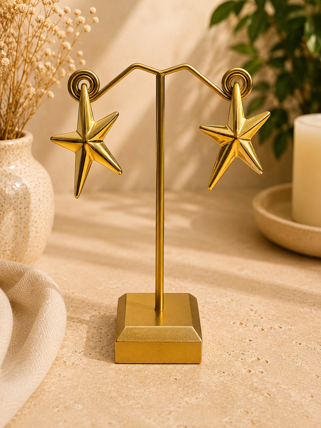 Pendientes estrella dorada