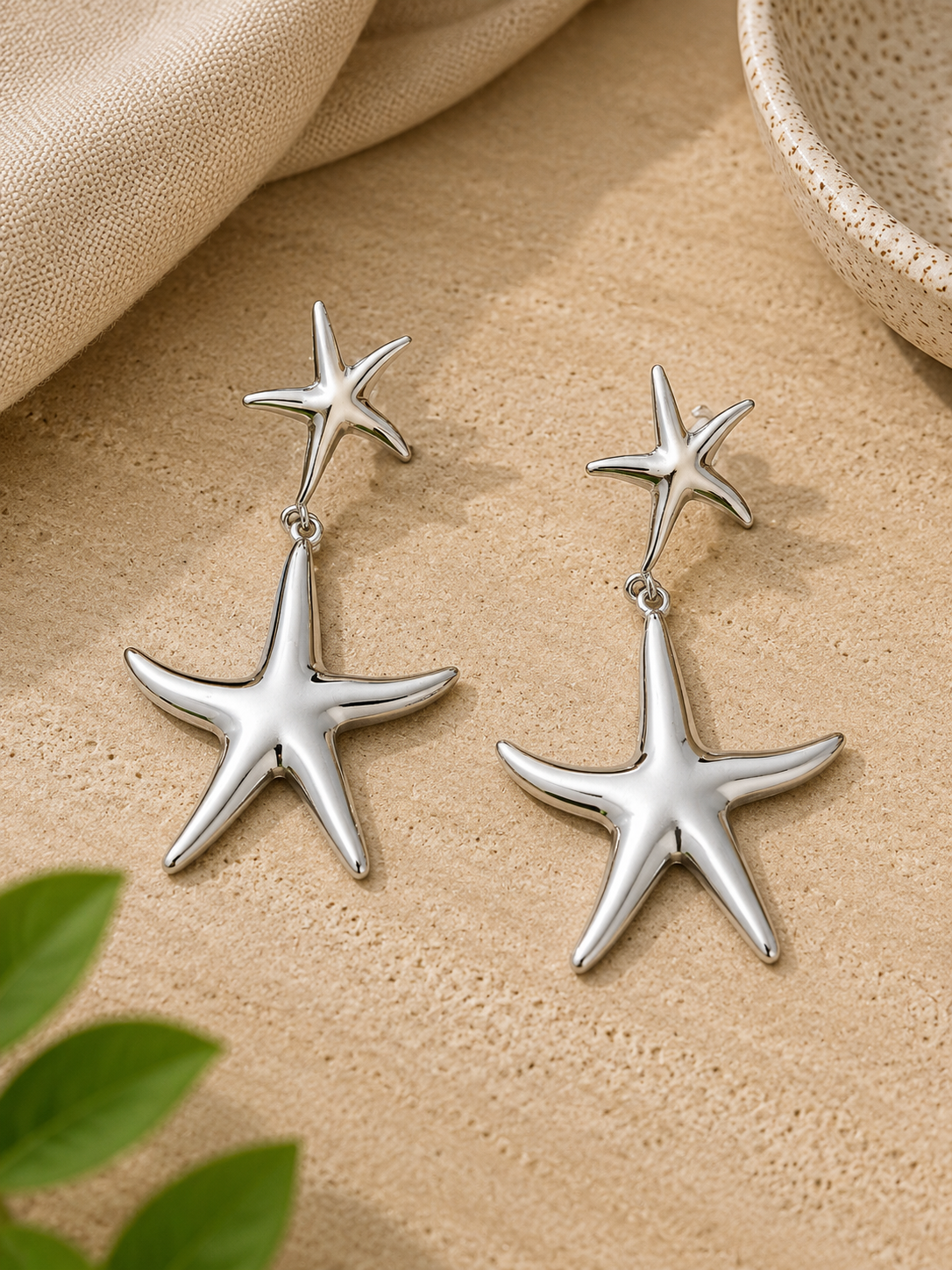 PENDIENTE DOBLE ESTRELLA PLATEADO