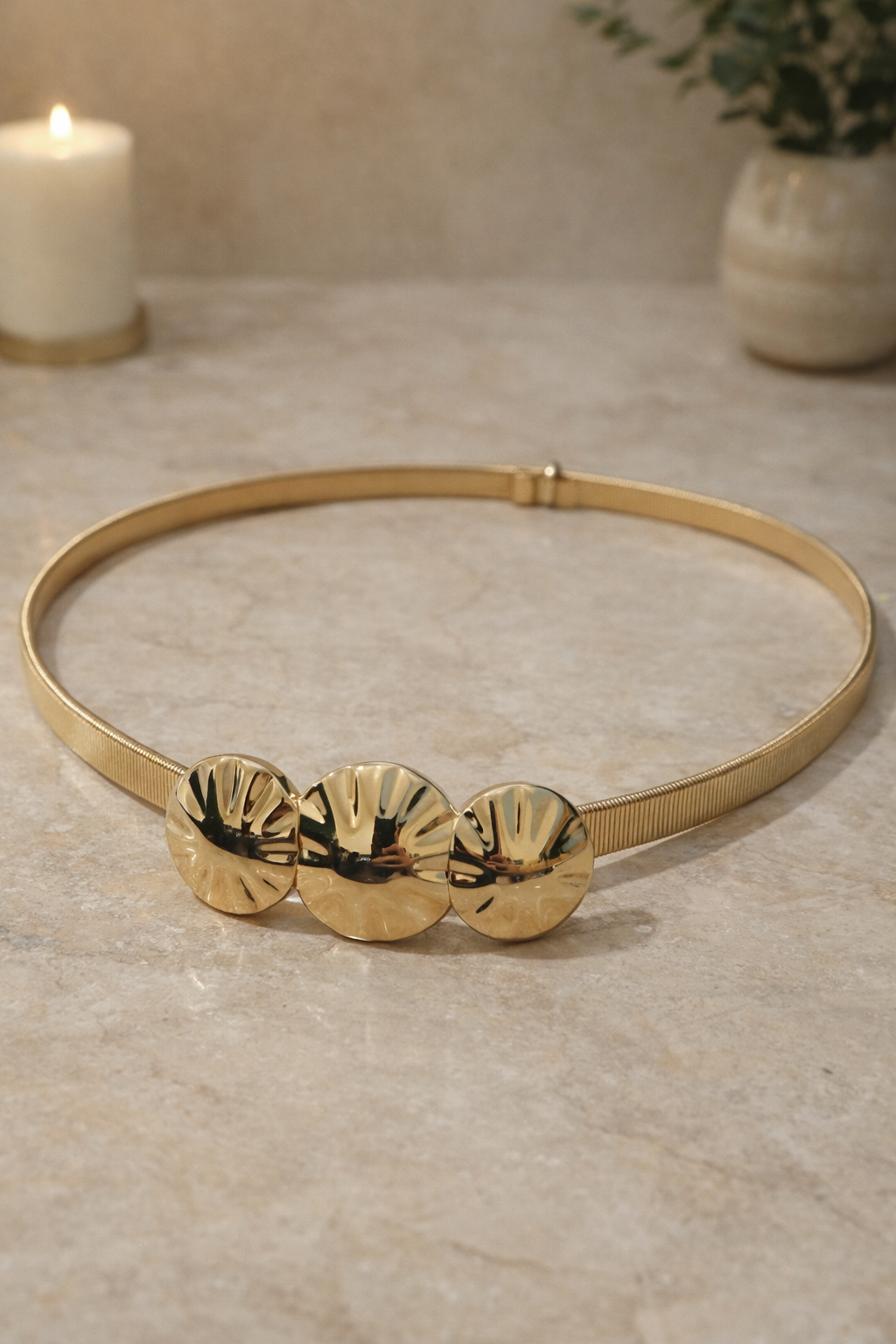 Cinturón dorado con discos